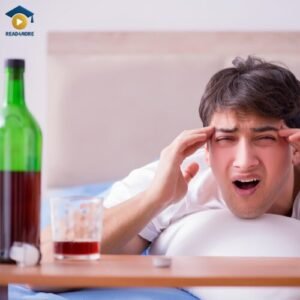 A man in bed with a hangover, looking unwell, illustrating the negative consequences of high alcohol consumption. This image from read4more.com is used in a medical English lesson on discussing sensitive lifestyle topics for the OET exam.