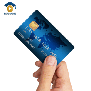 A hand holds up a blue credit card, a small piece of plastic used for payment. This image is a visual aid from read4more.com for a beginner's English lesson on everyday objects.