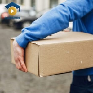 A person in a blue sweatshirt uses their arms to hold a cardboard package, illustrating the basic English verb 'to hold'. This image is a visual aid from read4more.com for a beginner's vocabulary lesson.