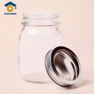 A clear, empty glass jar with its metal screw-top lid resting beside it. This image is a visual aid from read4more.com for a beginner's English lesson on common household objects.