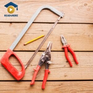 A collection of hand tools, including a saw, tin snips, and pliers, lying on a wooden surface to illustrate the English vocabulary word 'purpose'. This image is a visual aid for a beginner English lesson on read4more.com.