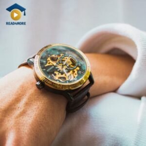 A close-up of a stylish watch on a person's wrist, highlighting the golden rim around the watch face. This image is a visual aid from read4more.com for a beginner's English lesson on describing parts of objects.