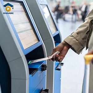A person using an airport kiosk to check in for a flight, visually defining the English phrasal verb "checked in" (registered before traveling) for the Read4More vocabulary glossary.