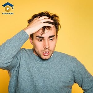 A young man holds his head with a shocked and hopeless expression, visually defining the English idiom "in despair" for the Read4More online vocabulary glossary.