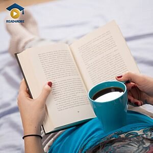 A person relaxing with an open book and a cup of coffee, visually defining the English vocabulary word "reading" (looking at and understanding written words) for the Read4More online glossary.