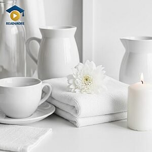 A collection of clean white items including a cup, towel, and candle, visually defining the English vocabulary word for the color of pure light for the Read4More online glossary.
