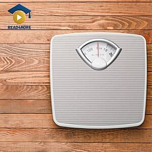 A grey analog scale placed on a wooden floor, visually defining the English vocabulary word for a weighing device for the Read4More online glossary.