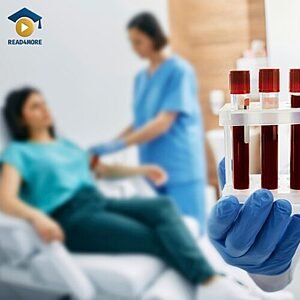 A close-up of a gloved hand holding test tubes filled with blood, with a nurse attending to a patient in the background, visually defining the English vocabulary phrase "blood test" for the Read4More online glossary.