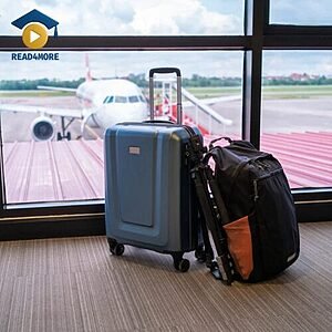 A blue suitcase and black backpack standing in an airport terminal with a plane in the background, visually defining the English vocabulary word "luggage" for the Read4More online glossary.